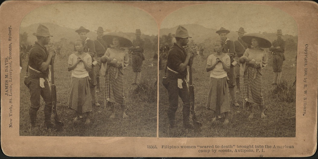 Filipino women “scared to death” brought into the American camp by scouts, Antipolo, P. I.